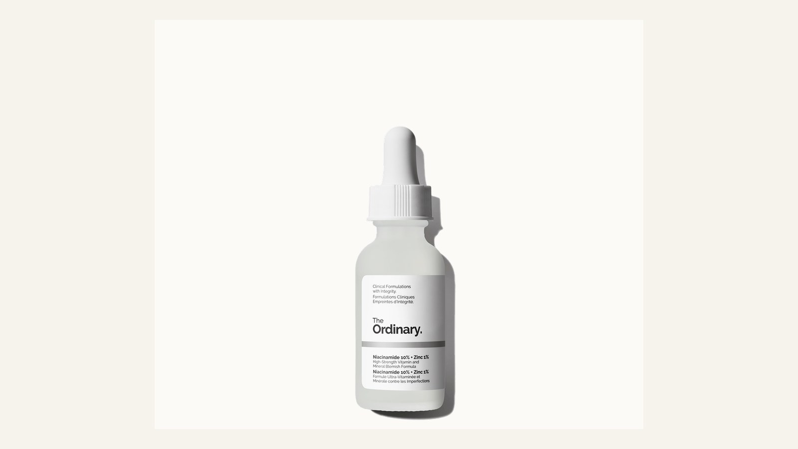 Niacinamide serum and ceramide cream compared on a skincare desk
